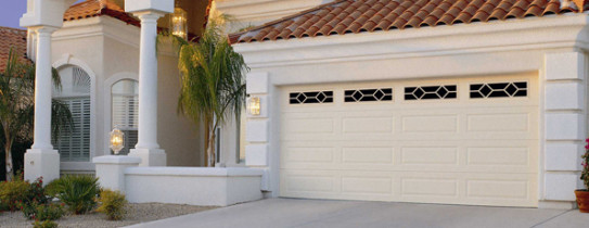 Cream Two Car Garage Door in Spanish Style Home