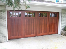 Four Red Wood Garage Doors with Glass Panels