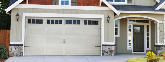 Grey Home With Matching Garage Door