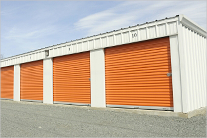 orange garage doors on storage unit