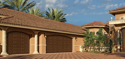 Three Car Garage with New Dark Wood Garage Doors