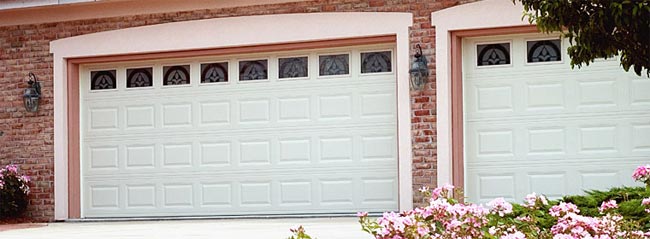 Two Garage Doors With Pink Border and Styled Glass